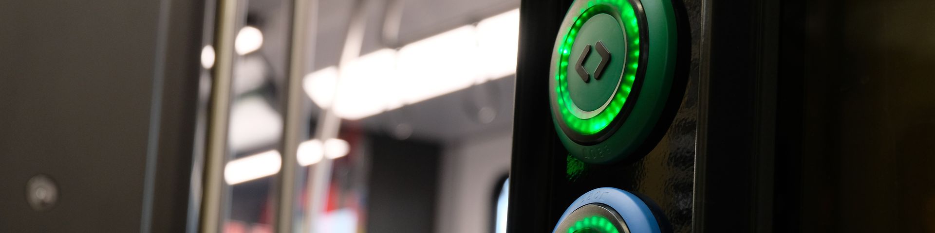 open train door with active, green lighted door opening buttons